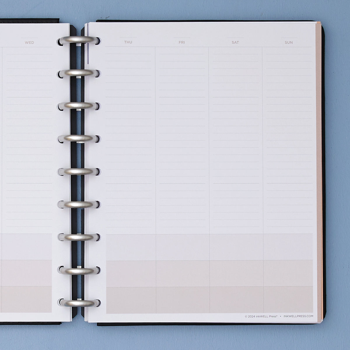 non-dated classic insert bundle with onyx black cover and silver discs weekly vertical planning spread