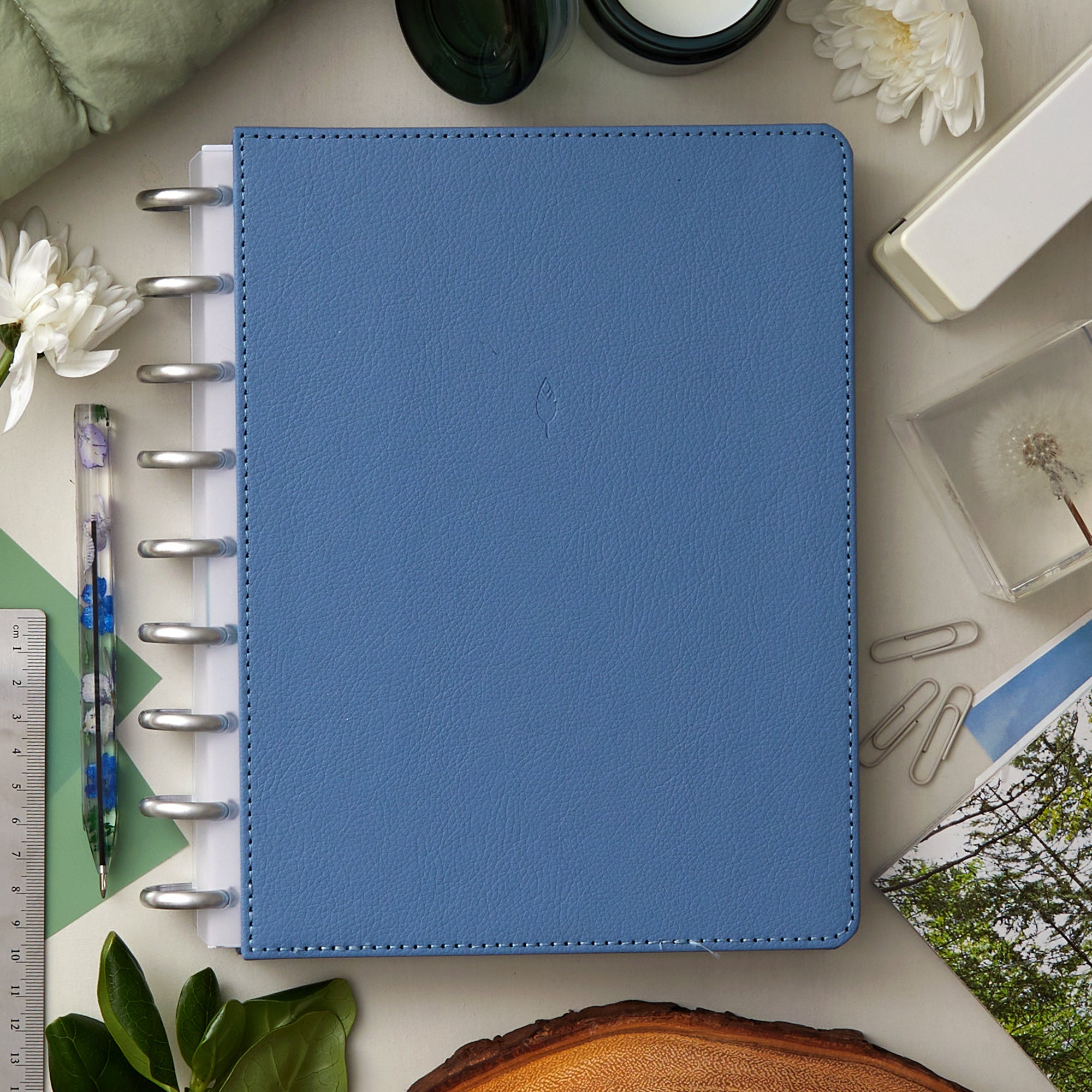 7x9 glacial blue front cover in faux vegan leather with silver discs and clear-white binding