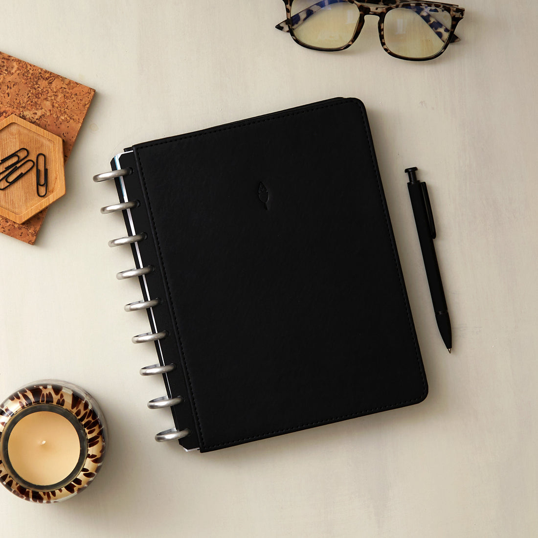 2026 planner in 7x9 size featuring black cover, silver discs, and monthly planning monthly layout