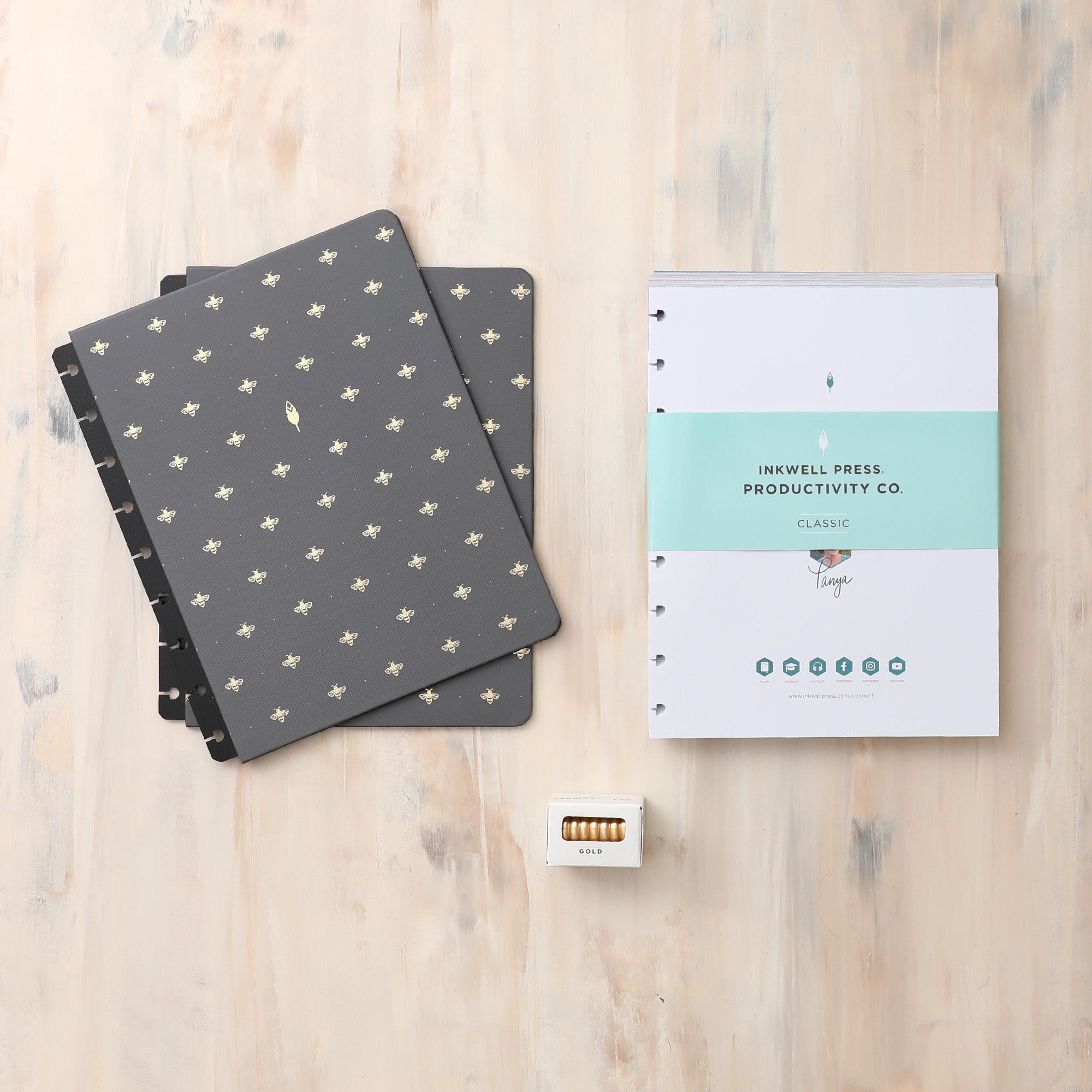 2024-2025 monthly inkwell press planner in 7x9 planner size featuring a rio green vegan leather cover, monthly planning, and premium gold discs
