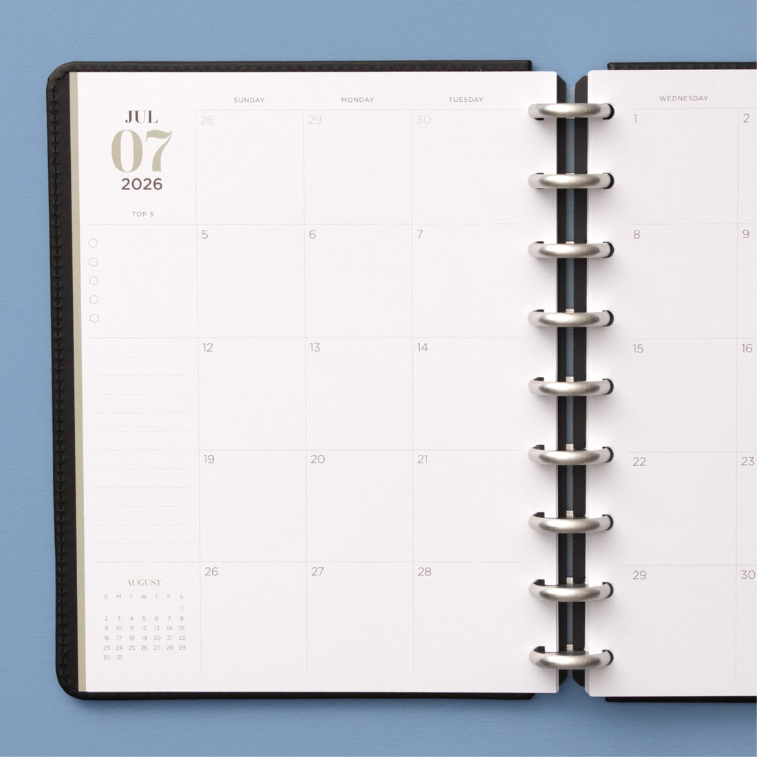 monthly spread featuring open writing space, bullet points, lined notes section for this 7x9 planner