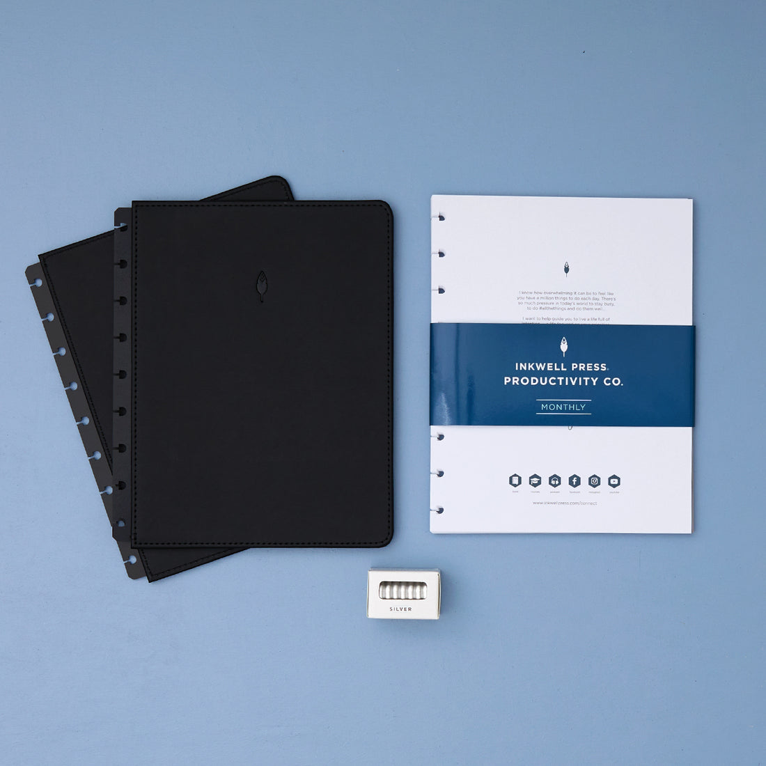 2026 planner in 7x9 size featuring black cover, silver discs, and monthly planning monthly layout