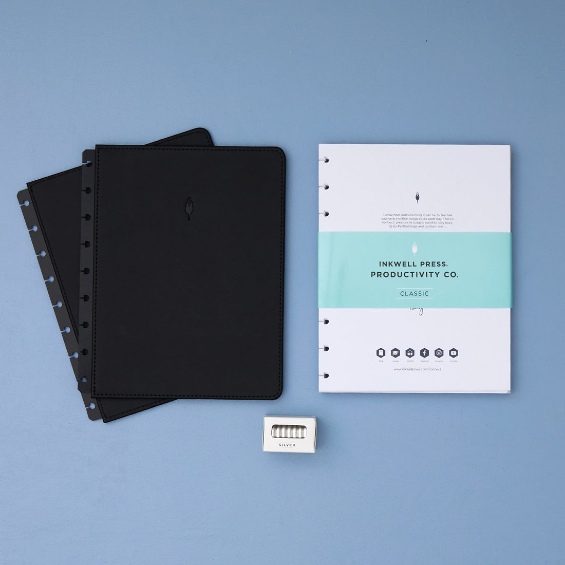 2026 planner in 7x9 size featuring black cover, silver discs, and classic vertical planning weekly layout