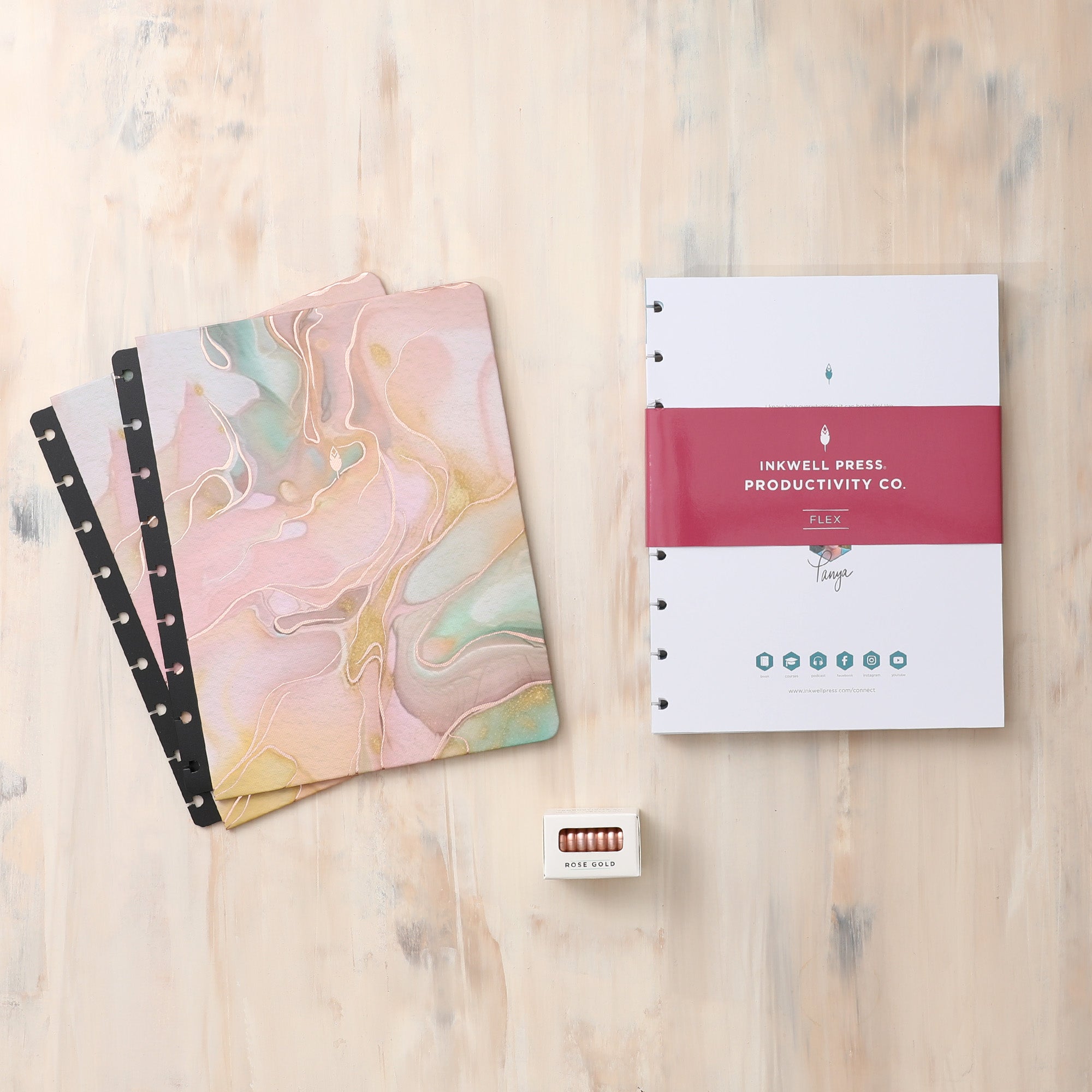 2024-2025 monthly inkwell press planner in 7x9 planner size featuring a rio green vegan leather cover, monthly planning, and premium gold discs