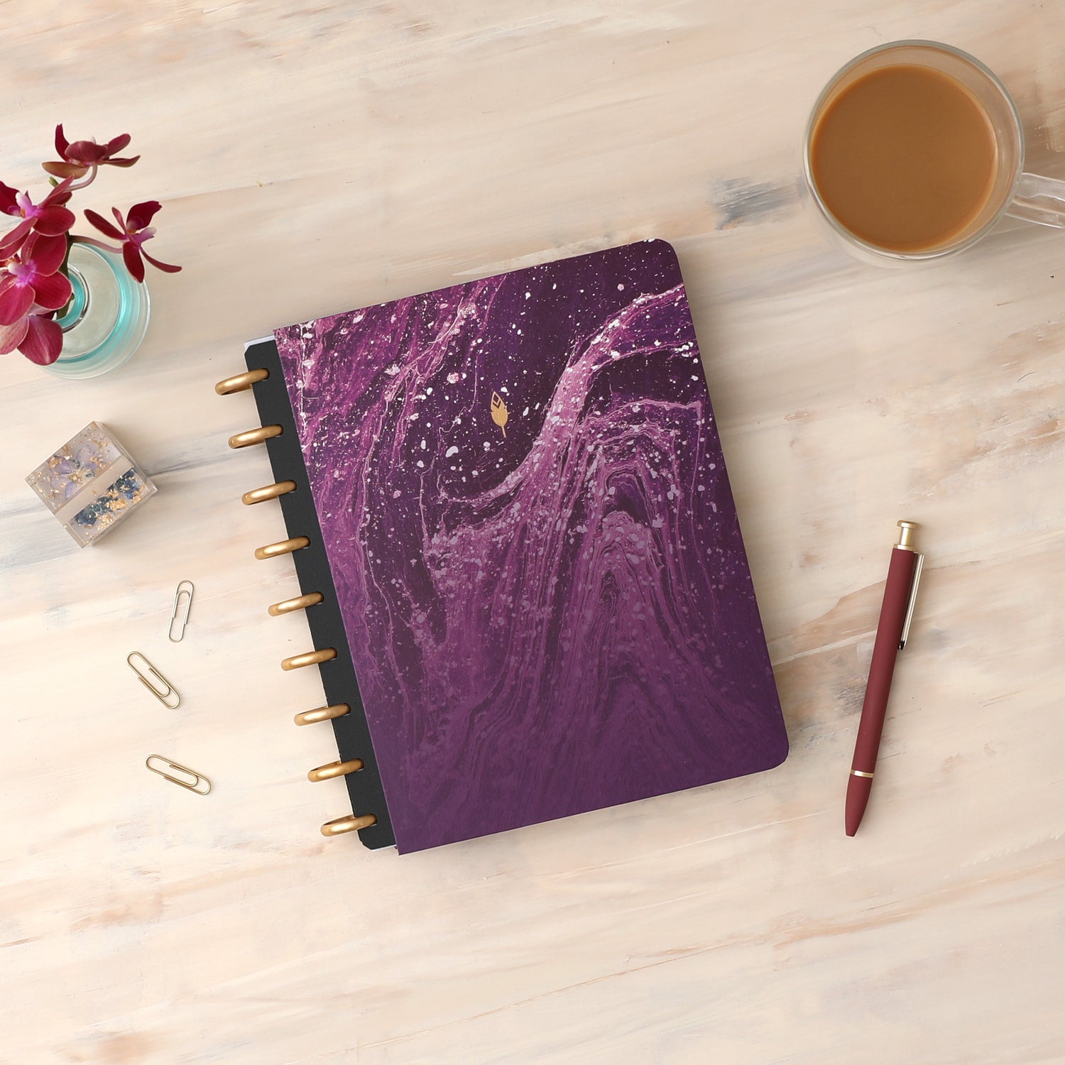 Amethyst Hard paper cover in 7x9 size featuring an elegant, geo wavy design in purple and gold discs.